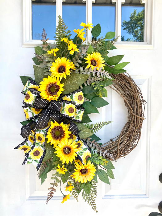 Sunflower Grapevine Wreath with Sunflower and Polka Dor Ribbon Bow with assorted greenery